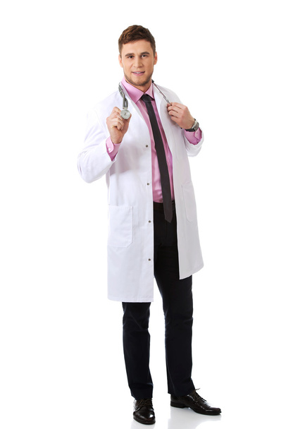 Happy male doctor with stethoscope. - 写真・画像