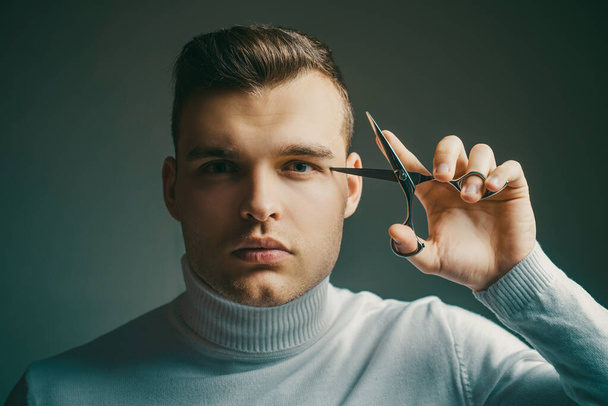 Barbershop service concept. Professional barber equipment. Cut hair. Man strict face hold scissors. Barber glossy hairstyle hold steel scissors. Create your style. Macho confident barber cut hair. - Photo, Image