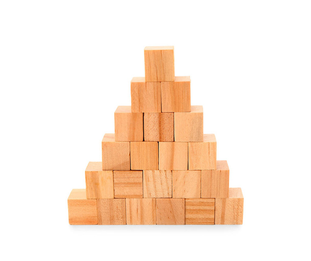Pyramid made of wooden cubes on white background - Foto, Imagen