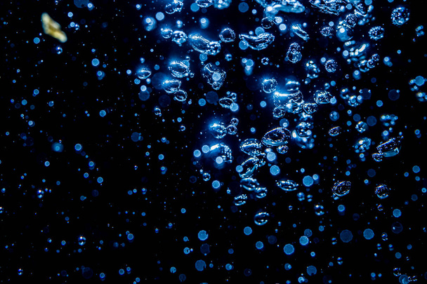 Bokeh from light in water with black background - Foto, immagini