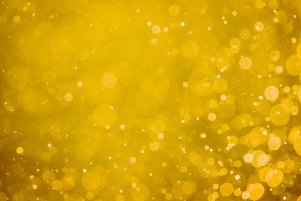 Absztrakt elmosódott arany bokeh körök használata a színes művészet és design háttér - Fotó, kép