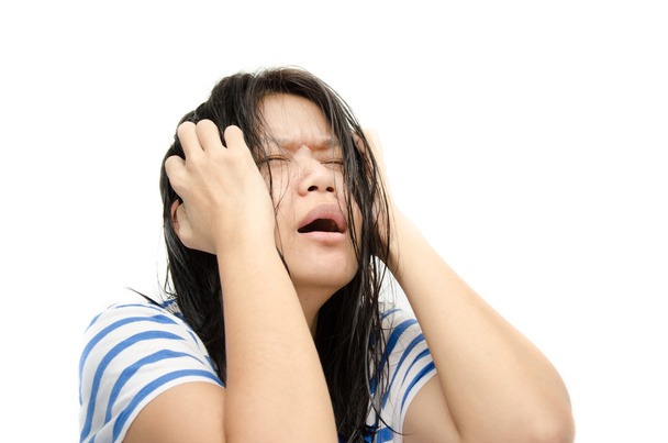 Woman stressed is going crazy pulling her hair in frustration. - Photo, Image