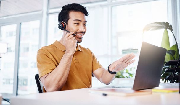 Customer service, laptop and happy business man talking on contact us, telemarketing or online telecom. Communication consultant, tech or Asian person in call center consulting for technical support. - Foto, Imagen