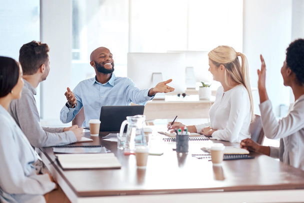 Meeting, question and collaboration with a businessman in the boardroom, talking to his team for planning. Teamwork, training and strategy with a black male employee asking a colleague for input. - 写真・画像