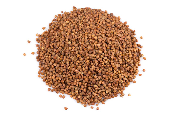 Pile of buckwheat seeds isolated over the white background - Photo, image