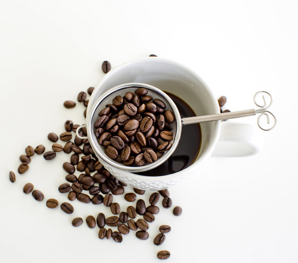 Coffee cup and coffee bean on white background - 写真・画像
