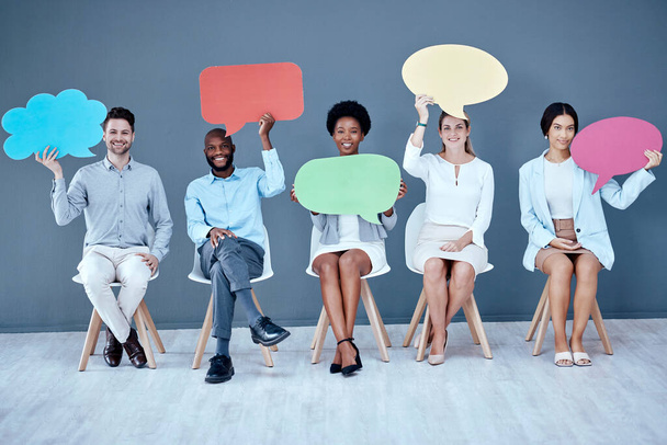 Employee group portrait, speech bubble and sitting in office for social media, diversity or opinion by wall. Businessman, women and chair for vote, recruitment or mockup on cloud poster, idea or news. - Photo, Image
