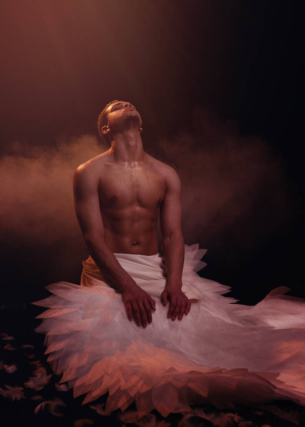 Young strong angel with white wings from heaven. Angel with muscular body. Sensual man - Fotografie, Obrázek