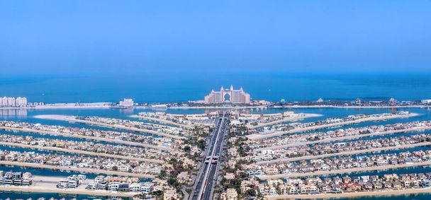 The modern structure of the man-made island Palm Jumeirah with the Altilantis Hotel viewed from a high tower - Photo, image