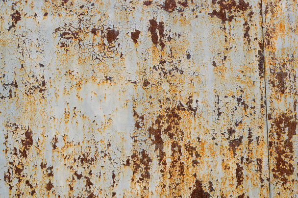 cracked paint on a metal coating, metal with rust, close-up shot - Photo, Image