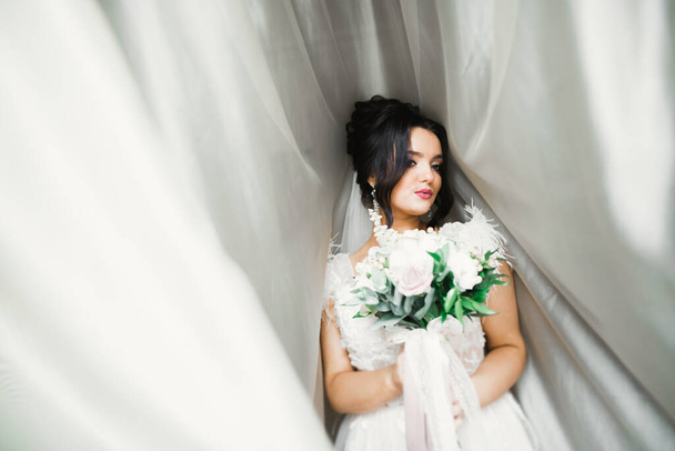 Bride holding big and beautiful wedding bouquet with flowers. - Zdjęcie, obraz