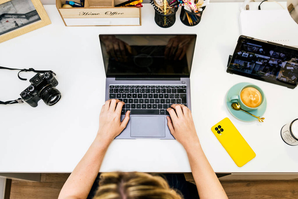 Blonde Woman Using Laptop In Office. - Fotografie, Obrázek