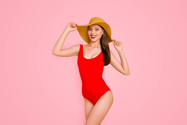 Closeup photo portrait of nice lovely cute careless with toothy beaming smile slim fit lady touching wide brimmed straw hat isolated on shiny vivid colorful background. - Photo, Image