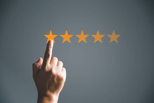 Customer service and Satisfaction concept, Business person are touching the virtual screen on happy Smiley face icon to give satisfaction in service. rating very impressed. customer service feedback. - Foto, immagini