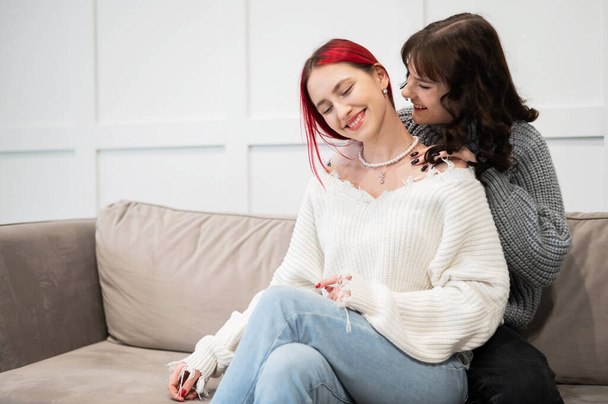 Two young Caucasian women embrace tenderly. Same-sex relationships - Foto, Bild