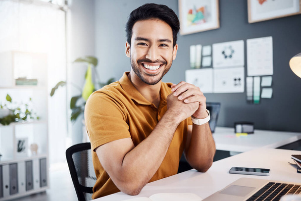 Smile, confidence and portrait of a man in the office while working on a business project with a laptop. Happy, success and professional Asian male corporate employee sitting by his desk in workplace. - Foto, immagini