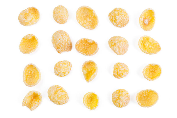 Corn-flakes background and texture. Top view. Traditional dry breakfast cereal. Placer of cornflakes on a white background. - Photo, Image