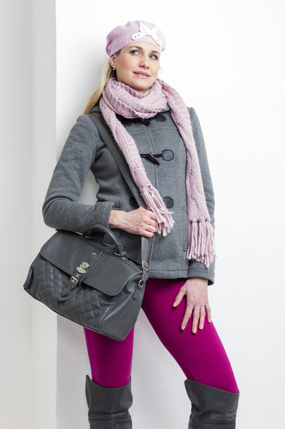 Woman wearing winter clothes with a handbag - Фото, зображення