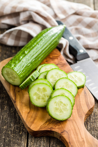 Sliced fresh green cucumber on the cutting board. - Foto, imagen