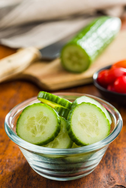 Sliced fresh green cucumber in the bowl. - Foto, imagen