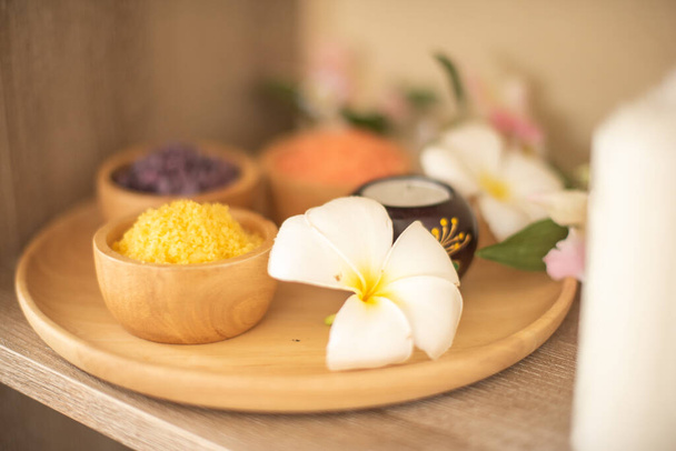 Wooden tray in close up shotadorned with a bowl of spa salt ingredients was breathtaking. - Foto, Imagem