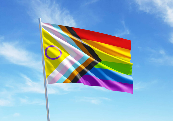 Progress Pride with intersex integration tęczowa flaga machająca na niebieskim niebie dla LGBTQIA + Pride month, wolność seksualna, święto różnorodności miłości i walka o prawa człowieka w ilustracji 3D - Zdjęcie, obraz