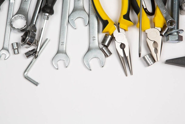 Set of tools for repair in a case on a white background. Assorted work or construction tools. Wrenches, Pliers, screwdriver. Top view - Photo, Image