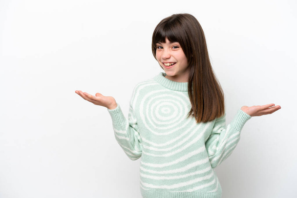 Little caucasian girl isolated on white background with shocked facial expression - Фото, изображение