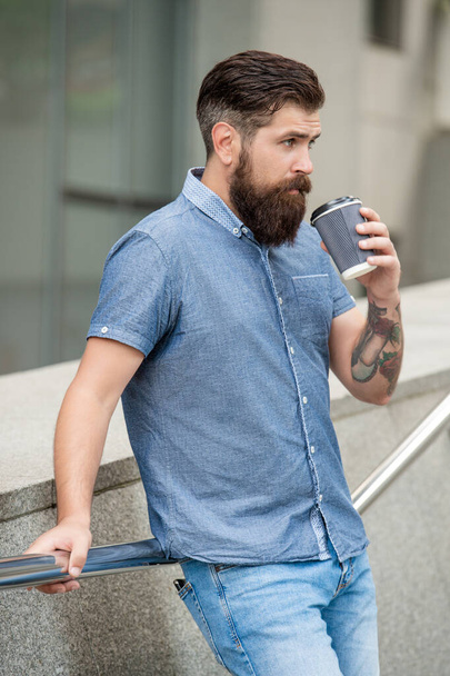 drinking mature man at coffee break in the street. photo of mature man at coffee break. mature man at coffee break outdoor. mature man at coffee break outside. - 写真・画像