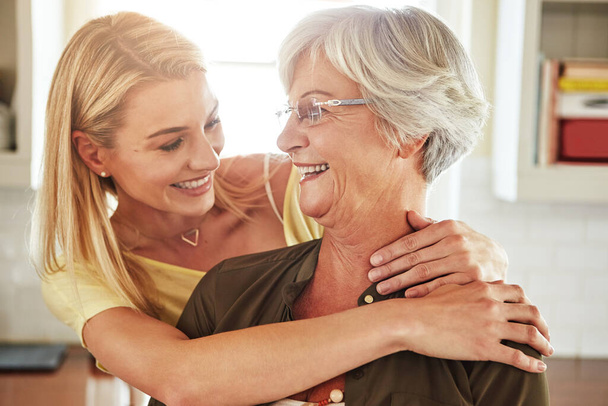 Moments with her mother. a senior woman and her adult daughter at home - Photo, Image