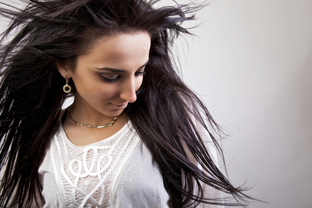 Armenian girl with healthy beautiful long hair in motion. Fashion look. - Valokuva, kuva