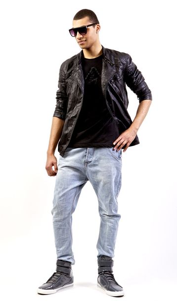 Young stylish mulatto in a leather jacket. - Valokuva, kuva