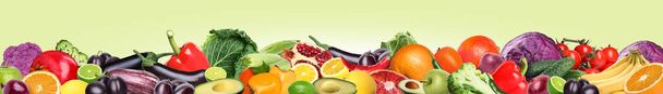 Many different fresh fruits and vegetables on pale light green background. Banner design - Фото, зображення