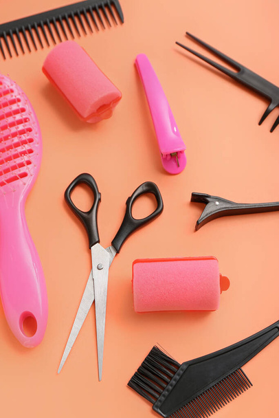Composition with hairdressing accessories on red background, closeup - Photo, Image