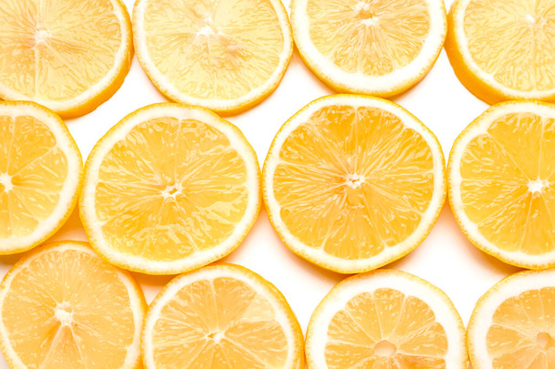 Textuur van gesneden citroenen als achtergrond - Foto, afbeelding