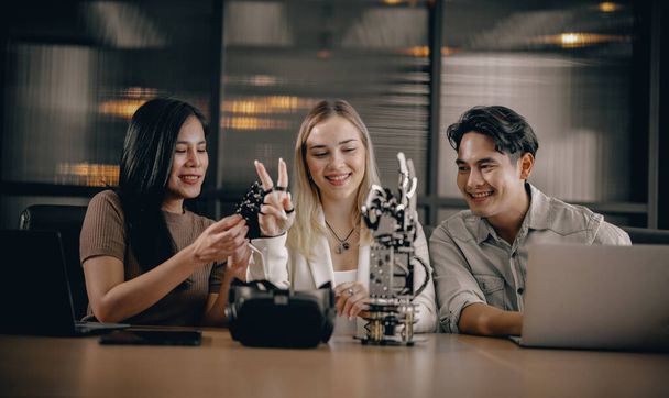College students join research group to do experiments with educational robot. Learn to combine engineering, programming, problem solving, and creativity skills. Share and discuss diverse viewpoints. - Foto, Imagen