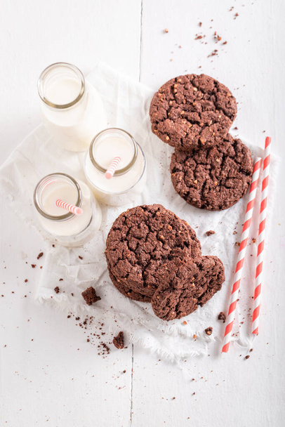 Homemade brown cookies as a popular snack. Brown cookies best taste with milk. - Foto, imagen