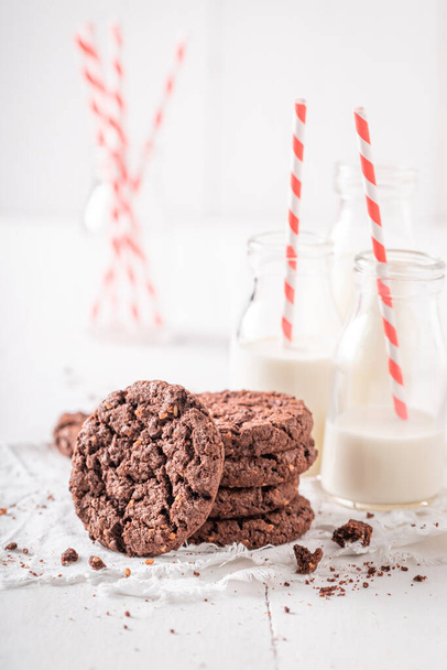 Tasty brown cookies as a popular snack. Brown cookies best taste with milk. - Photo, Image