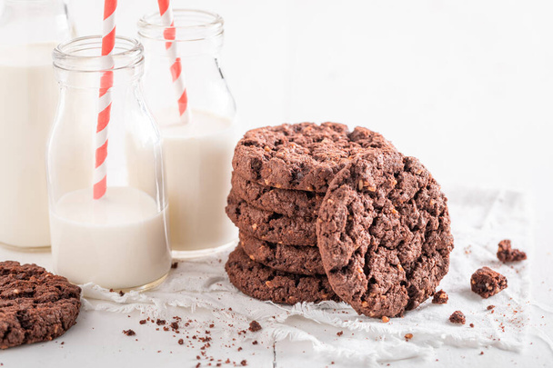 Delicious brown cookies as a popular snack. Brown cookies best taste with milk. - Фото, зображення