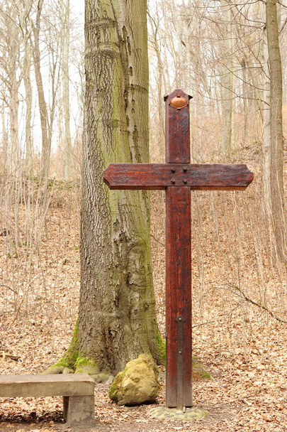 A large wooden cross in the forest - Fotó, kép