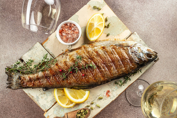 grilled trout served with white wine, Restaurant menu, dieting, cookbook recipe top view, - Photo, Image