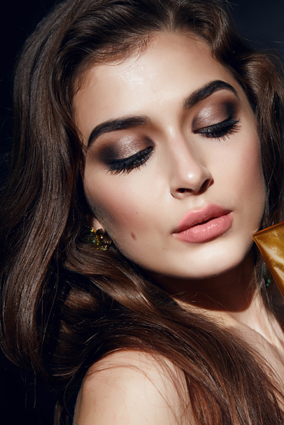 Beautiful sexy woman golden makeup brunett pink lips - Фото, изображение