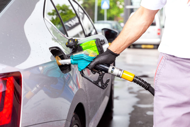 Fill up a car with diesel fuel at petrol station - Photo, Image