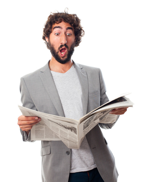young crazy man with a newspaper - Φωτογραφία, εικόνα