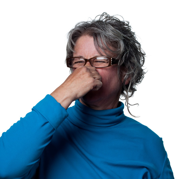 žena reaguje na velmi nepříjemný zápach - Fotografie, Obrázek