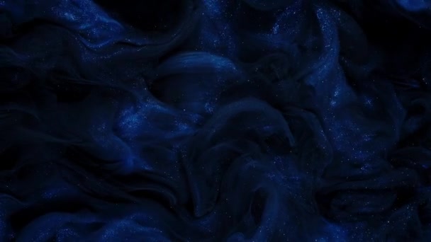 Abstract Blauwe Vloeibare Verven met Glitter Fumes in Mooie wervelingen. - Video
