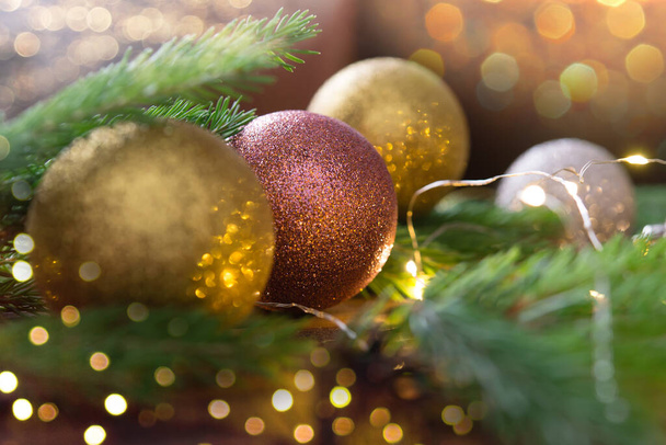 Beautiful christmas ball and decorations on the green fir tree. Bokeh lights. - Fotografie, Obrázek