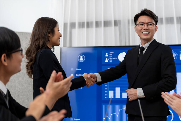 Businesspeople shake hand after successful agreement or meeting. Office worker colleague handshake with business team leader manager for strong teamwork in office to promote harmony and unity concept. - Zdjęcie, obraz
