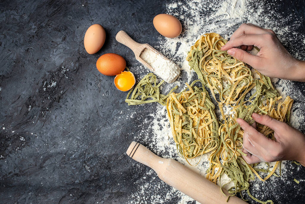 Closeup of process of making cooking homemade pasta. Chef make fresh italian traditional pasta. - Foto, immagini