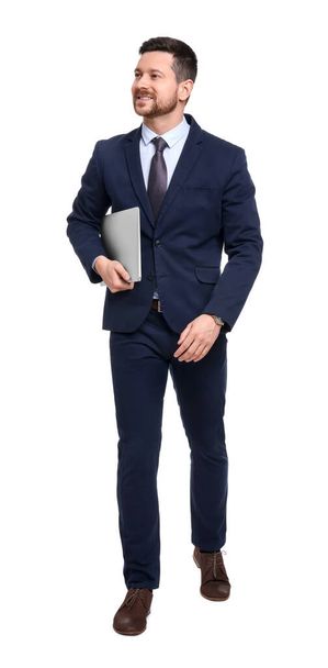 Handsome bearded businessman in suit with laptop on white background - Foto, imagen